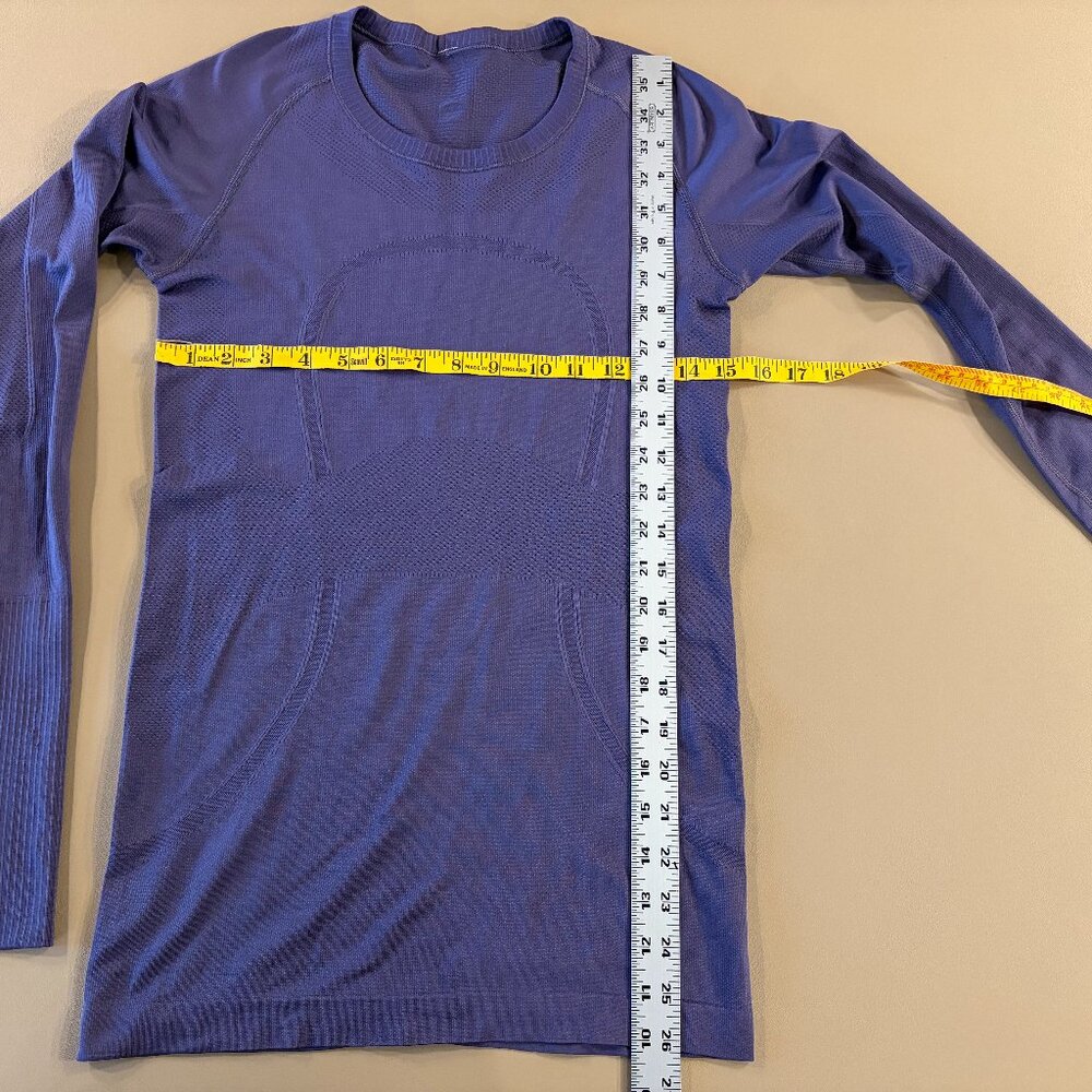 Lululemon purple sleeve stretch top in size 6